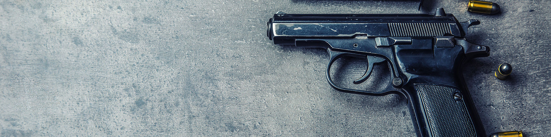 Violent crime gun on grey background